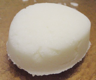 White sugar scrub bar on brown background