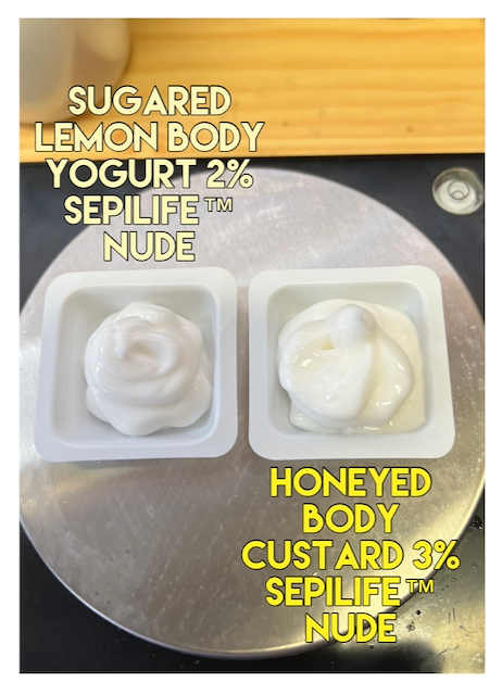 Two lotions on white plastic plates on the metal plate of a digital scale, both using SEPILIFE™ NUDE emulsifier. One is the sugared lemon body yogurt, the other a honeyed body custard. Both are white and thickened.